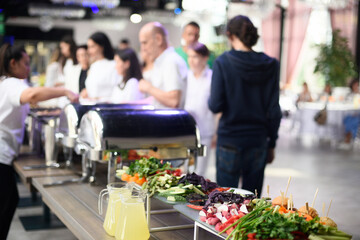 Catering, food and drinks, guests in the hall.