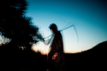 grim reaper, the death itself, scary horror shot of Grim Reaper holding scythe