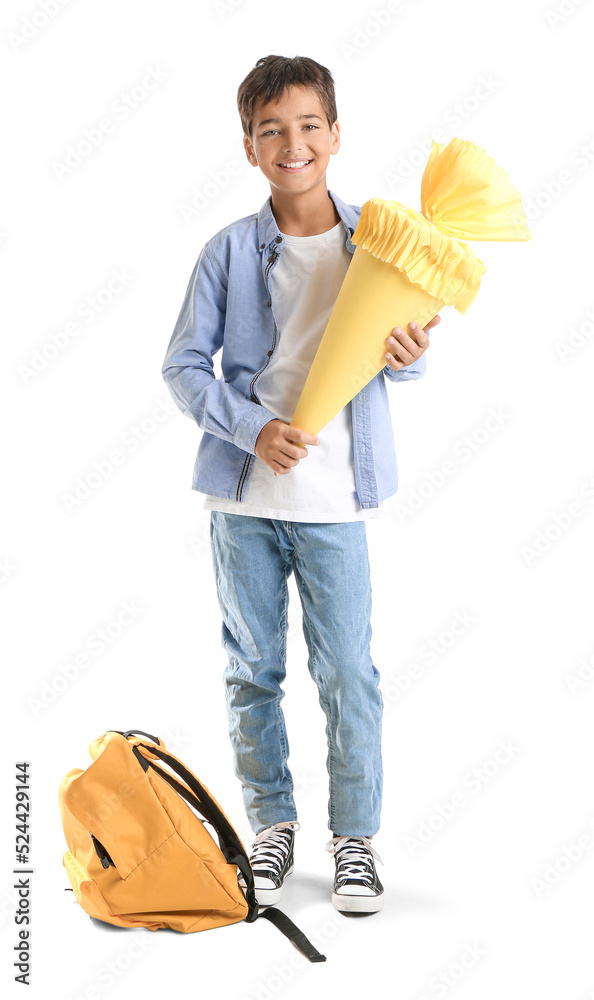 Little boy with yellow school cone on white background