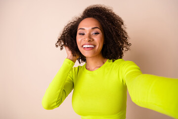 Sticker - Close up photo of young nice woman curly hair show followers new hairdo dressed stylish yellow outfit isolated on beige color background