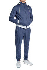 Male model of athletic build in a blue cotton tracksuit, zipper, hooded, full-length, isolated on a white background. Casual sport style.