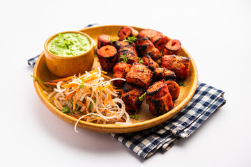 Wall Mural - Tandoori Soya Chaap or soy chap dish prepared by marinating in tandoori spices, closeup view