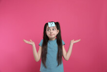 Confused Girl With Question Mark Sticker On Forehead Against Pink Background