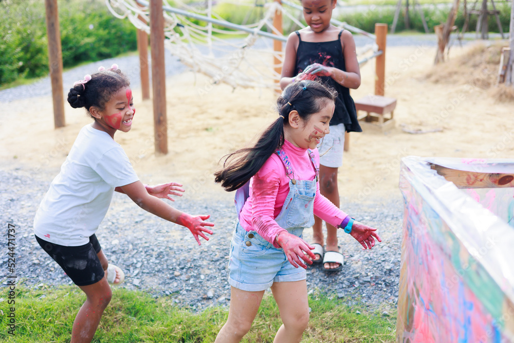 Happiness Affican girl run chatching Asian girl at playground. Diverse ...