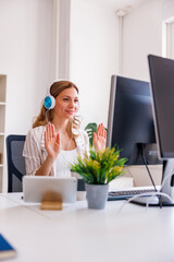 Woman having online meeting while working in an office