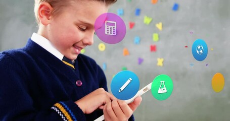 Sticker - Animation of colorful icons over caucasian schoolboy using tablet