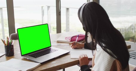 Poster - Animation of middle eastern girl in headphones having online lessons on laptop with copy space