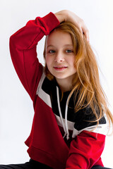 Cute little girl wearing an hoodie on white background
