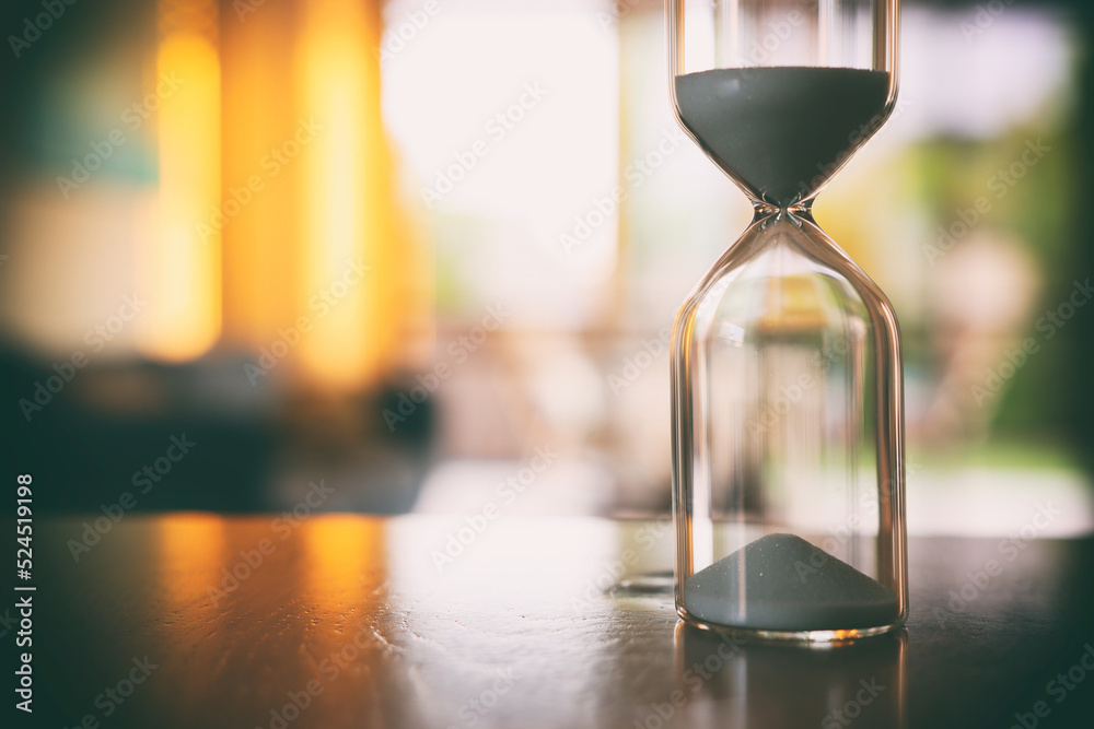 Clock Ina Hourglass Vintage hourglass clock over table Stock Photo | Adobe Stock