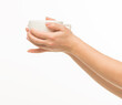 © serhii - female hands hold a white cup on a white background isolated