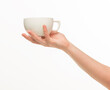 © serhii - female hands hold a white cup on a white background isolated