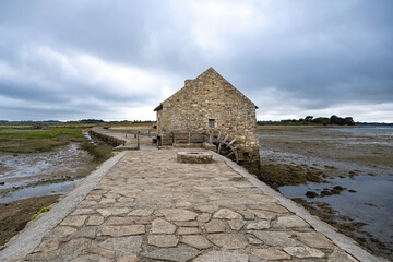 Wall Mural - Brittany, Ile d’Arz in the Morbihan gulf, the traditional tide mill, after the rain in summer