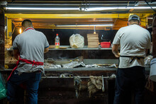 Open Air Mexican Taqueria Street Food Restaurant Where Two Mexicans Are Making Tacos And Quesadillas