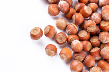 Wall Mural - Shelled hazelnuts on the white background