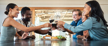 Friends, Wine Tasting And Toasting Alcohol With Drinking Glasses In Restaurant On Farm, Winery Estate Or Countryside Distillery. Diversity, Bonding Or Happy Men And Women Enjoying Vineyard Red Merlot