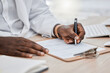 Doctor writing a prescription or medical history, record or insurance in his office and working on a health document. Closeup of a healthcare black male professional or GP signing a contract