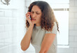 © Kay Abrahams/peopleimages.com - Pain, tooth ache and toothache from poor dental care, gum disease or bad personal hygiene routine in home bathroom. Stressed woman with cavity suffering and brushing teeth, cleaning mouth or grooming