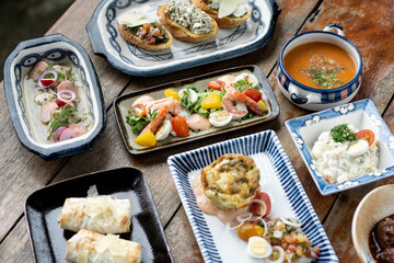 Wall Mural - selection of many different tapas on rustic wood table