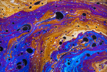 Macro Photo Of Colourful Pastel Swirly Patterns Of A Soap Bubble
