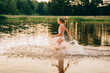© Iryna - Feeling freedom and fresh air. Happy active teenager girl in swimsiut running on the lake or river on a hot summer day at sunset. Summer cump, happy childhood, active lifestyle concept.