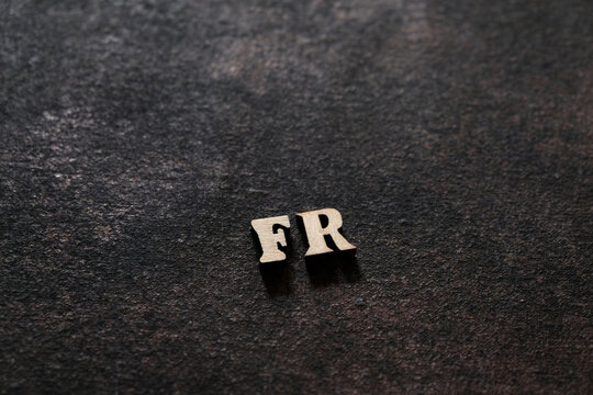 The letters F and R above the dark field. Initials FR