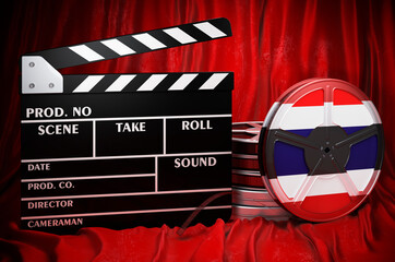 Thai cinematography, film industry, cinema in Thailand. Clapperboard with and film reels on the red fabric, 3D rendering