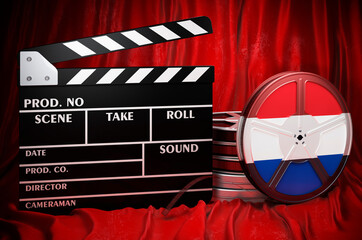 Poster - The Netherlands cinematography, film industry, cinema in the Netherlands. Clapperboard with and film reels on the red fabric, 3D rendering
