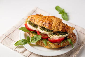 Crispy croissant with mozzarella cheese and pesto