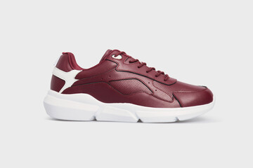 Wall Mural - Classic fashion leather women's burgundy pair of sneakers shoes for fitness gym running jogging isolated on white background, placed together