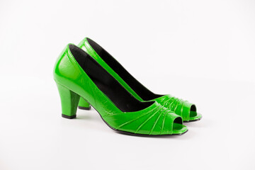 Poster - Female green leather shoes on white background, isolated product. Differentiated footwear and exclusive design.