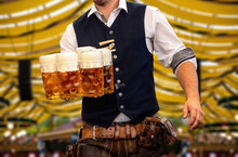 Oktoberfest, Munich. Waiter Serve Beer, Close Up. Octoberfest German Festival.