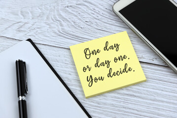 Wall Mural - Yellow adhesive note with inspirational quotes - One day or day one.  You decide.