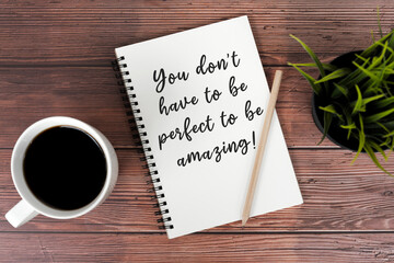 Wall Mural - Cup of coffee and note pad with inspirational text - You don't have to be perfect to be awesome