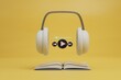 © Igor - modern technologies. listening to an audiobook with headphones. headphones, audiobook and start icon on audio track on yellow background. 3d render. 3d illustration