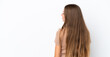 © luismolinero - Young Lithuanian woman isolated on white background in back position and looking side