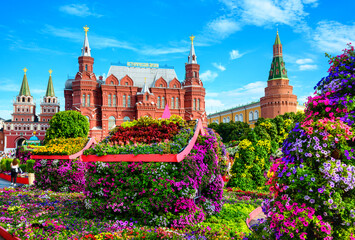 Wall Mural - Flowers near Historical Museum (it's written on roof) and Kremlin, Moscow, Russia