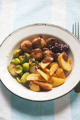 Wall Mural - Chicken meatballs with roasted potatoes with brussel sprouts and cabbage 