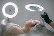 © Anna - Cosmetologist and dermatologist makes a moisturizing, rejuvenating woman lying patient in a beauty salon.