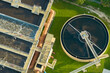 © bilanol - Aerial view of modern water cleaning facility at urban wastewater treatment plant. Purification process of removing undesirable chemicals, suspended solids and gases from contaminated liquid