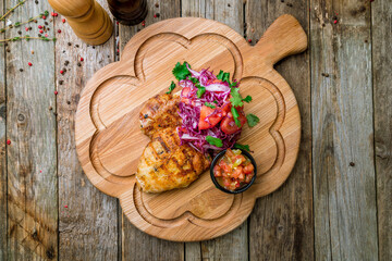 Poster - Grilled chicken Breasts with cabbage and sauce on the board top view