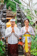 © Odua Images - happy beautiful balinese couple greeting and smiling gesture at camera