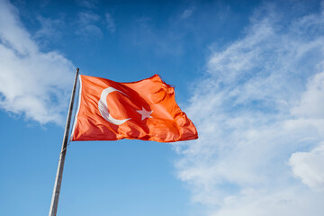 turkey flag under the blue sky waving beautifully