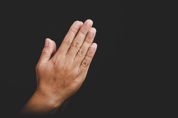 Close up Asian christian woman hands person pray and worship for thank god in church with black background, The concept for faith, spirituality and religion