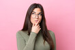 Leinwandbild Motiv Young Brazilian woman isolated on pink background With glasses and having doubts
