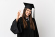© luismolinero - Teenager Brazilian university graduate over isolated white background showing ok sign with fingers