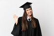 © luismolinero - Teenager Brazilian university graduate over isolated white background saluting with hand with happy expression