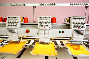 High technology automatic sewing machine control by computer programming. Sewing machine for mass production manufacturing industrial factory