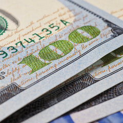 Wall Mural - american banknotes of one hundred dollars. fragment of bills close-up. new sample money. focus on th