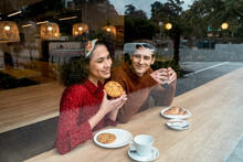 Happy Romantic Couple Enjoying Coffee Break In Cafe