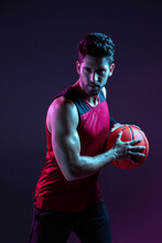 Studio Shot Of Basketball Player In The Studio With Purple Background